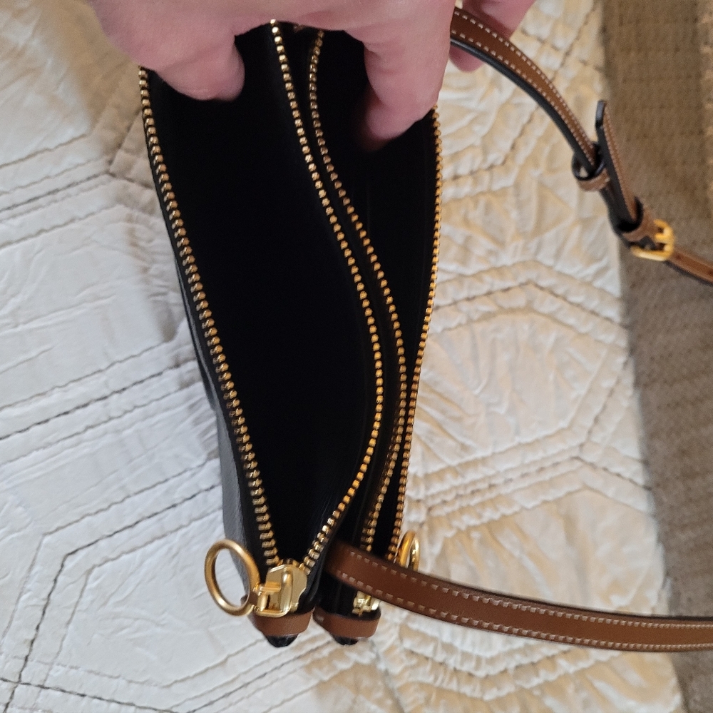 Tory Burch black leather small purse with brown leather strap.